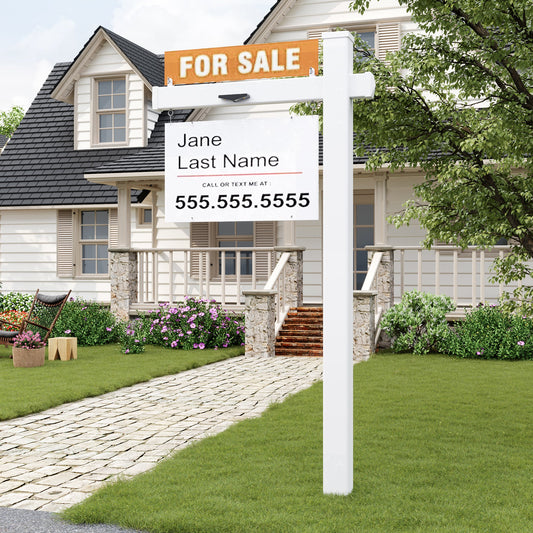 Real estate sign in front of a house