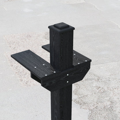 Black wooden post with steps on a gray concrete surface