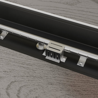 Metal track lighting fixture on a wooden surface