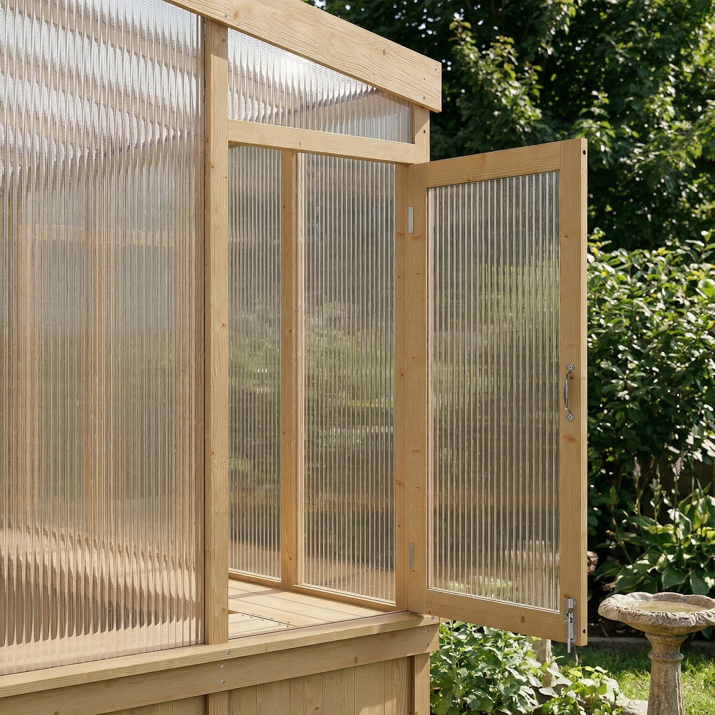 Wooden greenhouse with a transparent polycarbonate roof and walls, set against a natural background.